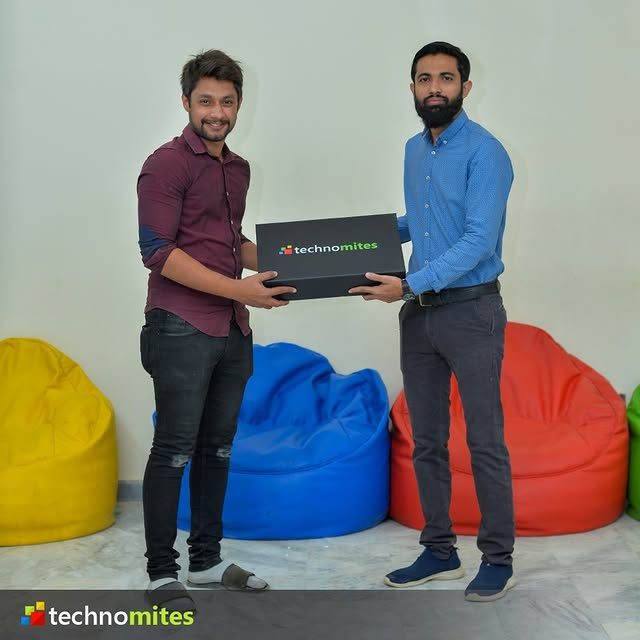Team member receiving a Technomites welcome gift
